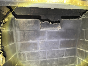 Damaged brickwork visible inside a chimney, showing the need for repair or inspection by Chimney Care experts in Doraville, GA.