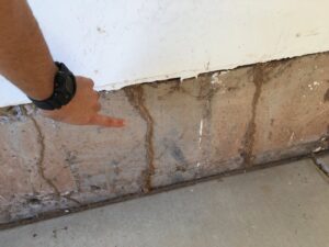 Damaged ductwork in an attic, likely caused by rodents or wildlife, requiring service from Green Machine Pest Control in Mesa, AZ.