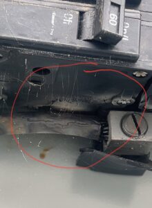A close-up of a damaged electrical breaker, a common issue for HVAC systems, serviced by A/C Company Since 1988 in Murfreesboro, TN.