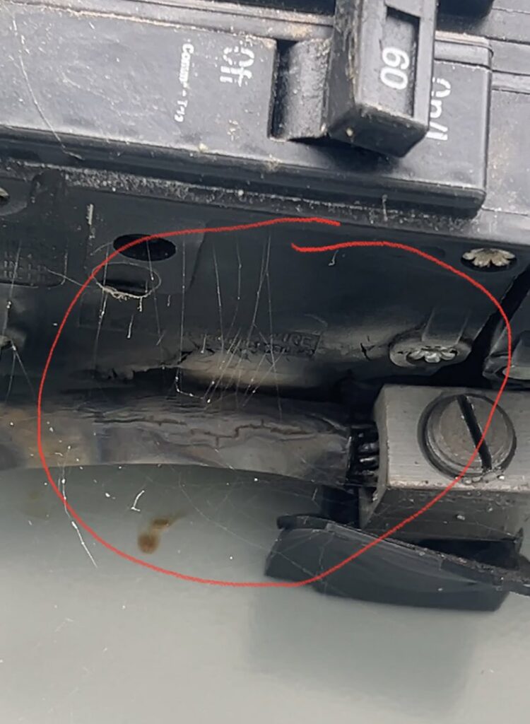 A close-up of a damaged electrical breaker, a common issue for HVAC systems, serviced by A/C Company Since 1988 in Murfreesboro, TN.