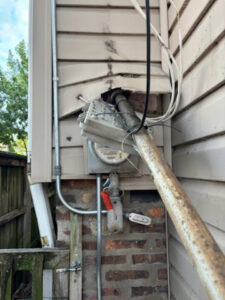 Damaged electrical meter and service entrance requiring repair by JAL Electrical Construction in Hammond, IN.