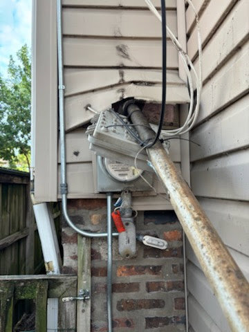 Damaged electrical meter and service entrance requiring repair by JAL Electrical Construction in Hammond, IN.