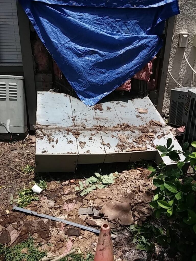 Damaged electrical panel area undergoing repair or service upgrade by Acme Electrical & Ac Services Inc in Tampa, FL.