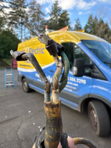Damaged electrical wires and cables, indicating a repair job by Mr. Electric of Rogers in Rogers, AR.