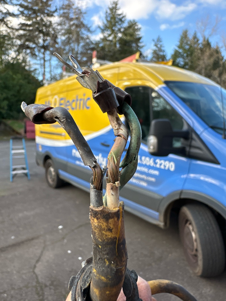 Damaged electrical wires and cables, indicating a repair job by Mr. Electric of Rogers in Rogers, AR.
