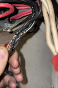 A close-up of damaged electrical wires needing repair, handled by C&J Electric in Miles City, MT.