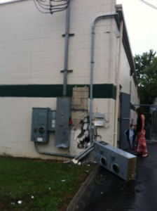 Damaged exterior electrical boxes and conduit on a building wall repaired by C.N.Copeland Electrical Service in Knoxville, TN