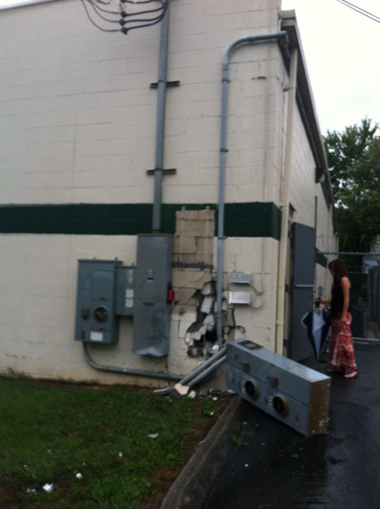 Damaged exterior electrical boxes and conduit on a building wall repaired by C.N.Copeland Electrical Service in Knoxville, TN