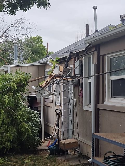 A damaged exterior electrical service with exposed wiring, requiring repair by Copper Canyon Electric in Farmington, UT.