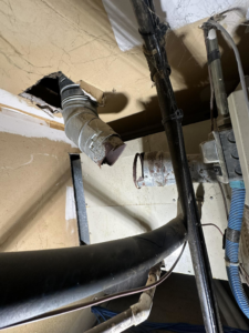 Damaged HVAC ductwork visible through a ceiling opening, serviced by Central Comfort Air in Miami, FL