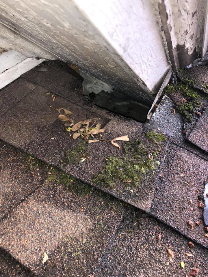 Damaged roof corner with debris, indicating a potential wildlife entry point, inspected by Evictus Wildlife Solutions in South Bend, IN.