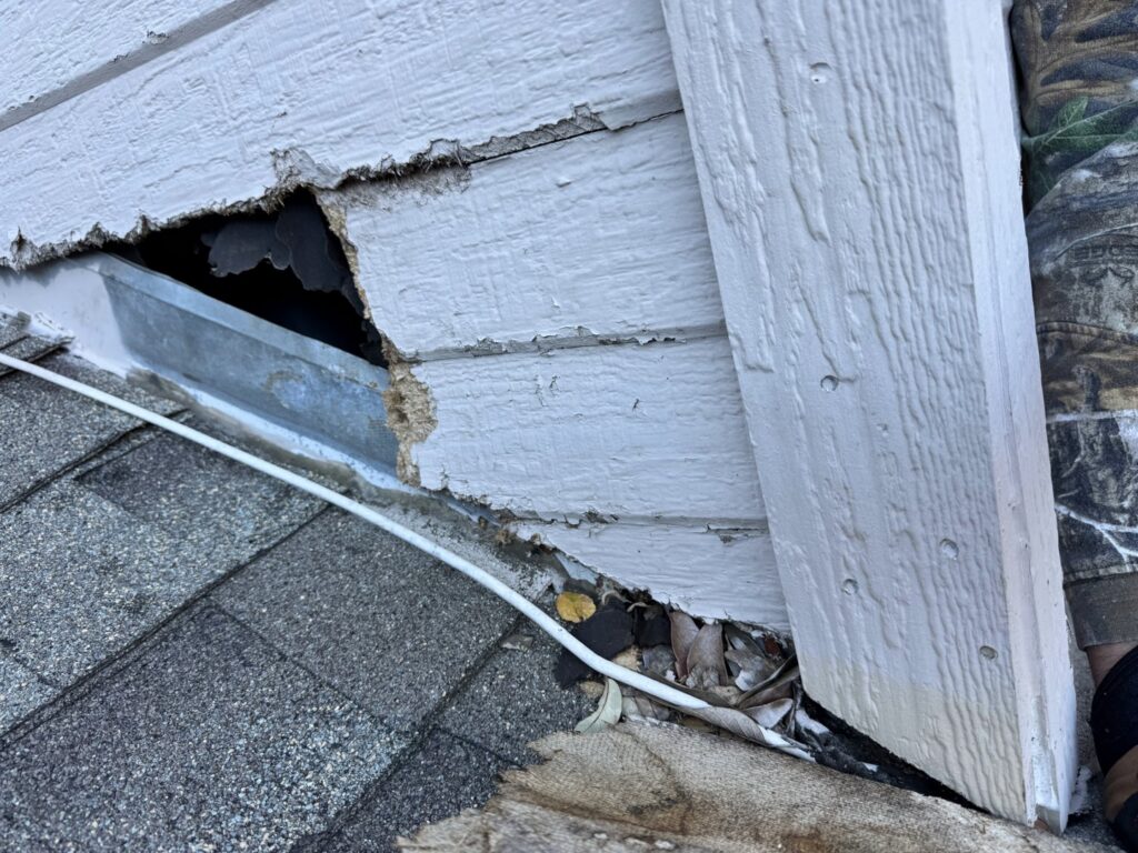 Damaged siding and roof edge showing a clear entry point for wildlife, addressed by Texas Rodent Control in San Antonio, TX.
