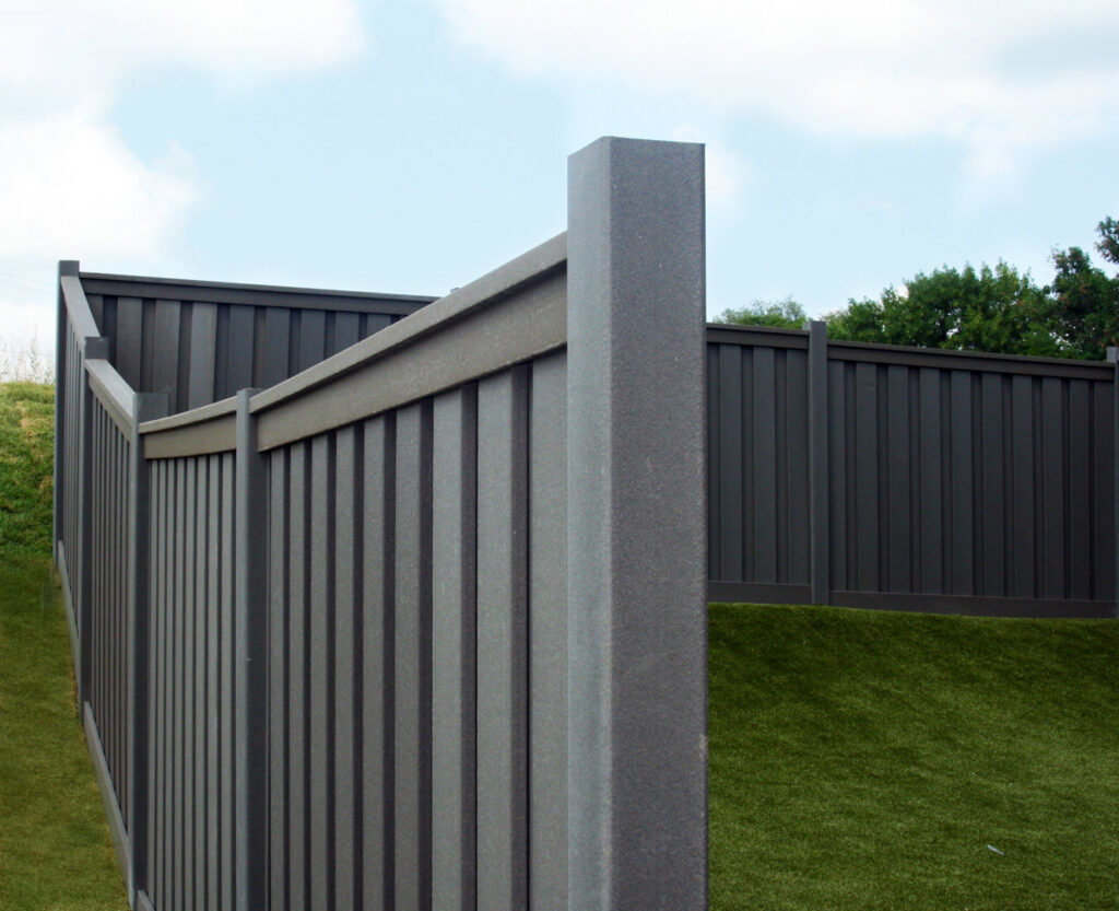 A dark composite privacy fence installed by American Fence Company of Columbus in Grand Island, NE.