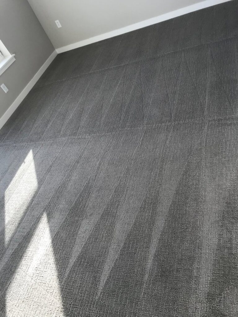 A dark gray carpet showing fresh cleaning lines after a service by Kung Fu Carpets and Cleaning Co. in Meridian, ID.