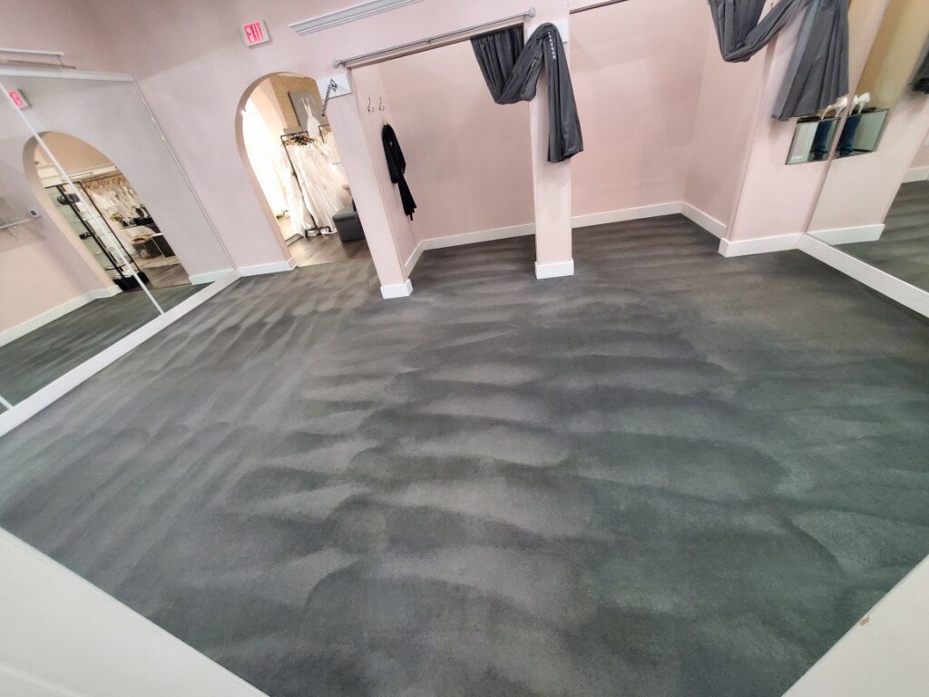 Dark grey carpet showing distinct cleaning lines after service by TLC Carpet Cleaning, Inc. in Lewisville, TX.