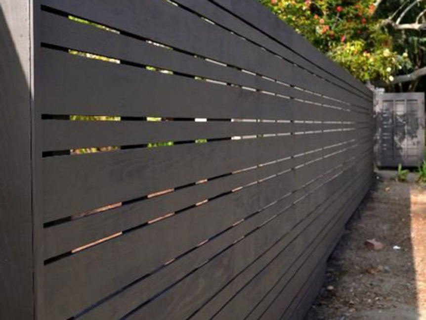 A stylish dark grey horizontal slat fence providing modern privacy by Freeman Fence in Atlanta, GA.
