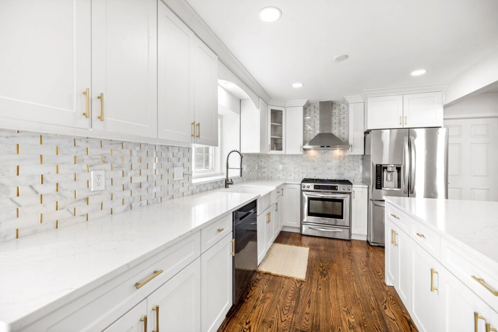 Beautiful dark hardwood flooring in a modern kitchen installed by Nations Best Flooring & Carpet Co. in Livonia, MI.