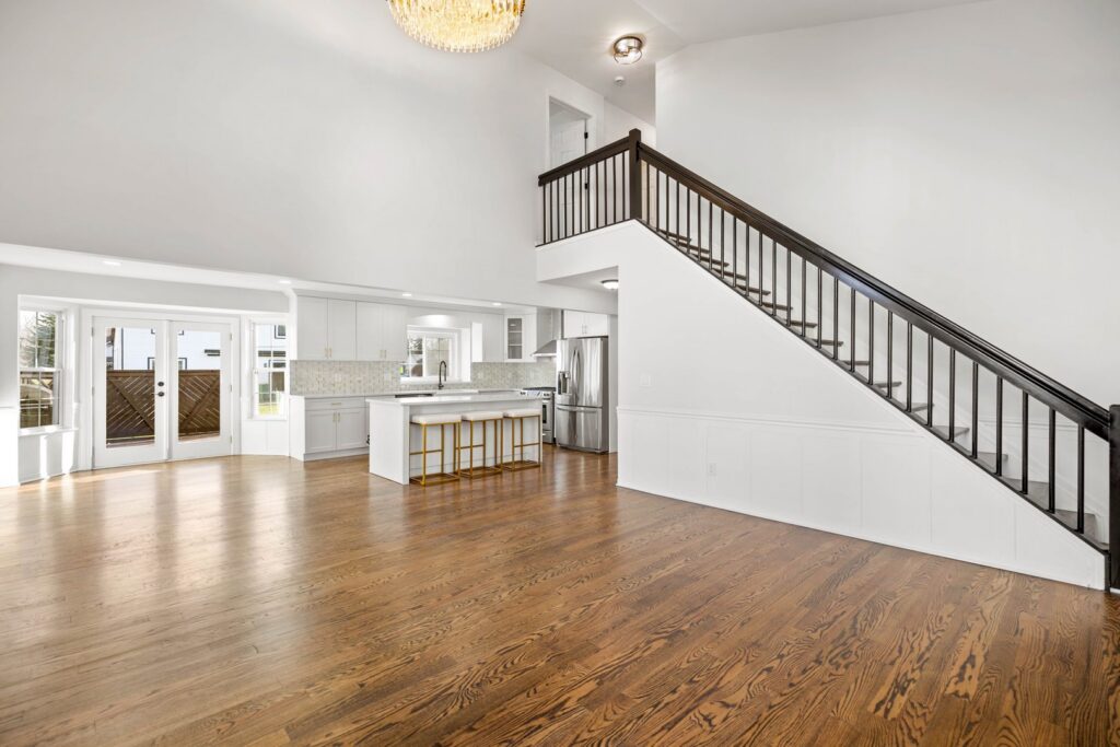 Expansive dark hardwood flooring in an open concept living space by Nations Best Flooring & Carpet Co. in Livonia, MI.