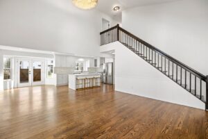 Expansive dark hardwood flooring in an open concept living space by Nations Best Flooring & Carpet Co. in Livonia, MI.