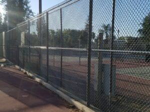 A modern dark horizontal slat privacy fence or enclosure, built by The Fence Company in Fresno, CA.