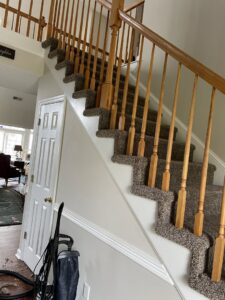 Professional installation of dark speckled carpet on a staircase by Johnson City Flooring & Finish, LLC in Johnson City, TN