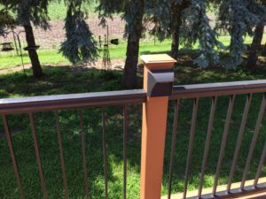 Close-up of a deck post with a modern light fixture installed by McPhillips Electric LLC in Columbus, NE.