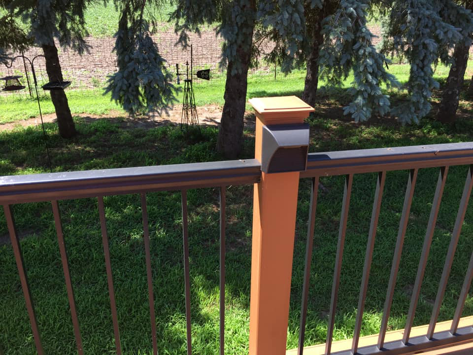 Close-up of a deck post with a modern light fixture installed by McPhillips Electric LLC in Columbus, NE.
