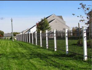 A decorative black and white aluminum fence installed for a residential area by Snyders Custom Fencing in York, PA.