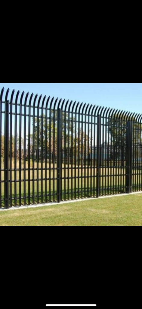 A decorative black metal fence with curved tops, showcasing quality craftsmanship by Gonzalez Iron Work in Oakland, CA.