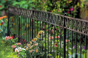 An elegant decorative black metal fence installed by The Columbus Fencing Company in Columbus, GA.