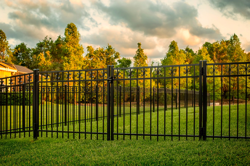 A decorative black ornamental fence installed in a yard by St. Charles Fence & Deck Company in Saint Peters, MO.