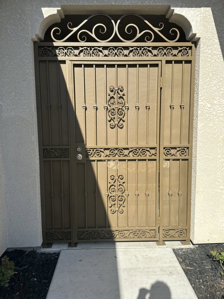 A decorative brown iron entry gate, providing security and style from Exclusive Custom Iron Works in Stockton, CA.