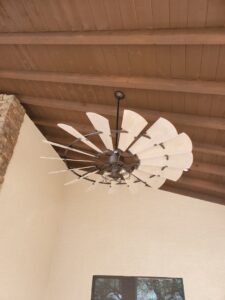 A large decorative ceiling fan installed on a wooden ceiling by G5 Electric, LLC in Evansville, IN.