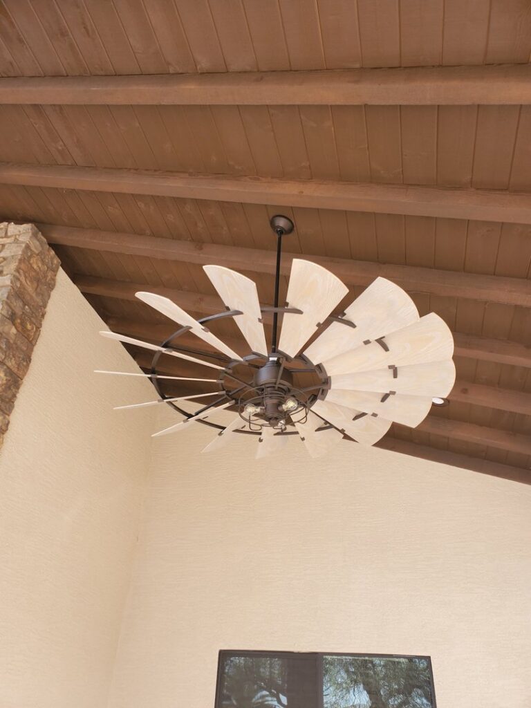 A large decorative ceiling fan installed on a wooden ceiling by G5 Electric, LLC in Evansville, IN.