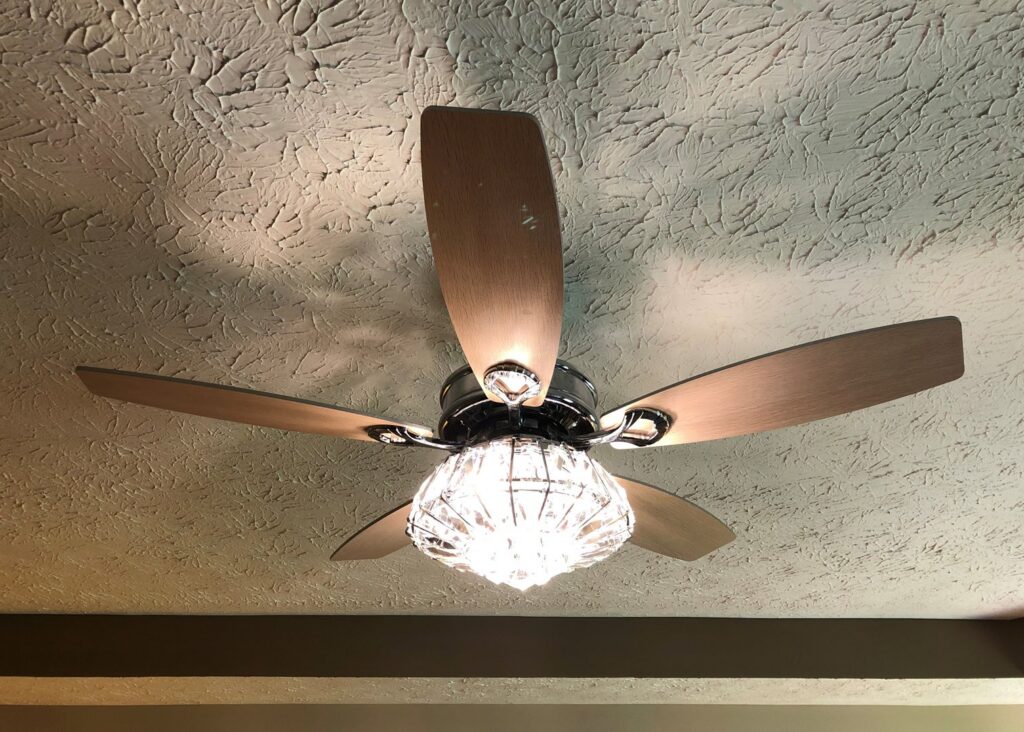 A decorative ceiling fan with a crystal light fixture installed by Top Tier Electrical Services LLC in Knoxville, TN