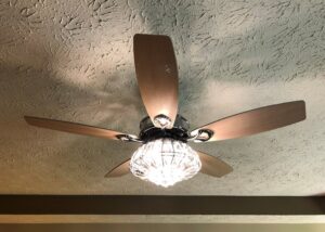 A decorative ceiling fan with a crystal light fixture installed by Top Tier Electrical Services LLC in Knoxville, TN