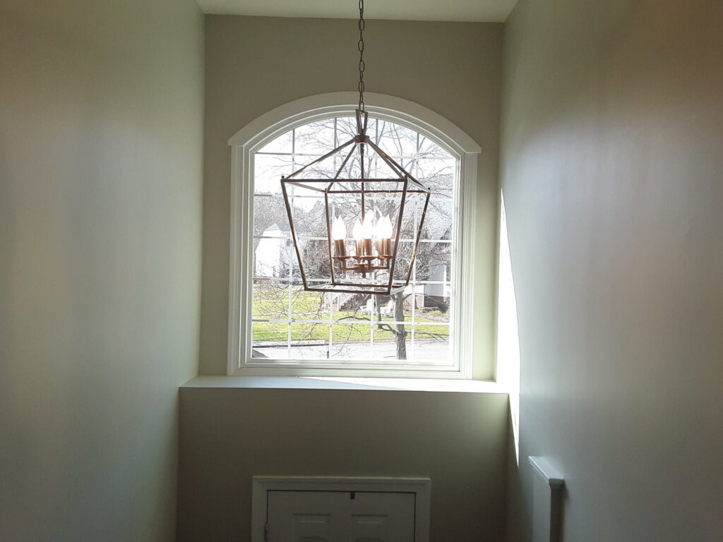 A large decorative chandelier installed in an entryway or stairwell by C. C. Taylor Electric LLC in Powhatan, VA.
