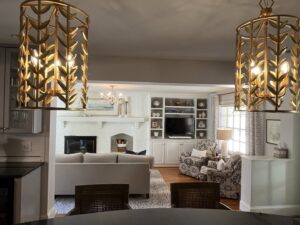 Elegant decorative chandeliers illuminating a living room, expertly installed by All Connected Electric LLC in Raleigh, NC.