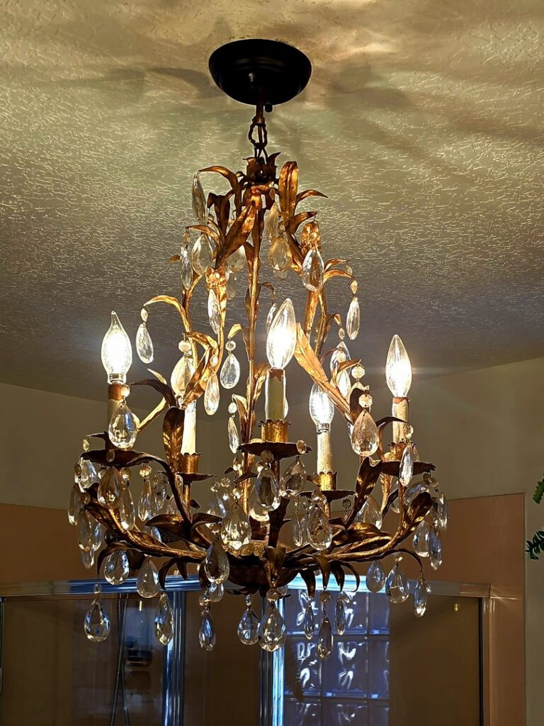 A beautifully installed decorative chandelier with lights on, showcasing work by Zia Electrical Services in Albuquerque, NM