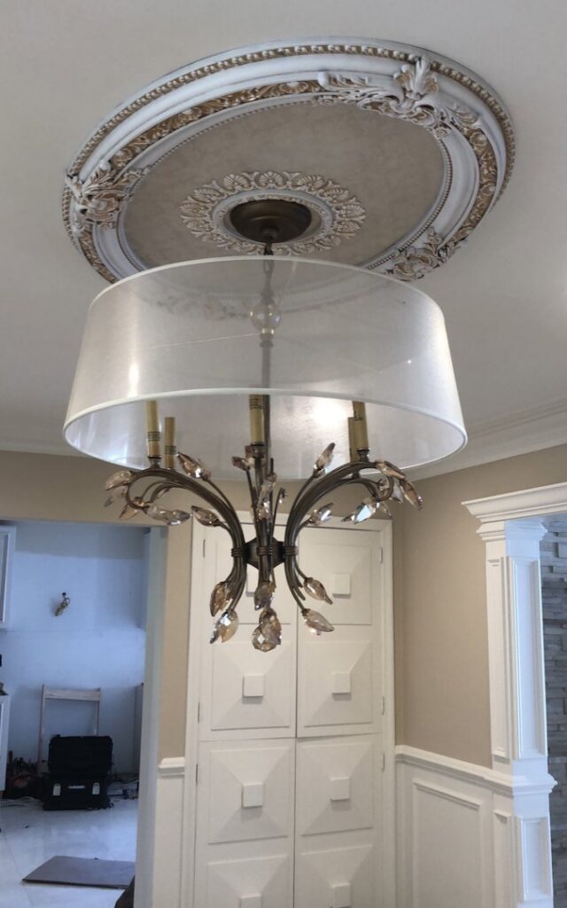 A decorative chandelier with a ceiling medallion installed by Electric R US LLC, providing lighting in Dearborn, MI.