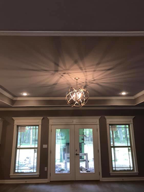 Living area showcasing a decorative chandelier and recessed lighting installed by JMD Electric, LLC in O'Fallon, MO.