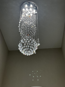 A beautiful decorative crystal chandelier installed by Harris Boys Electrical Services in Flint, MI
