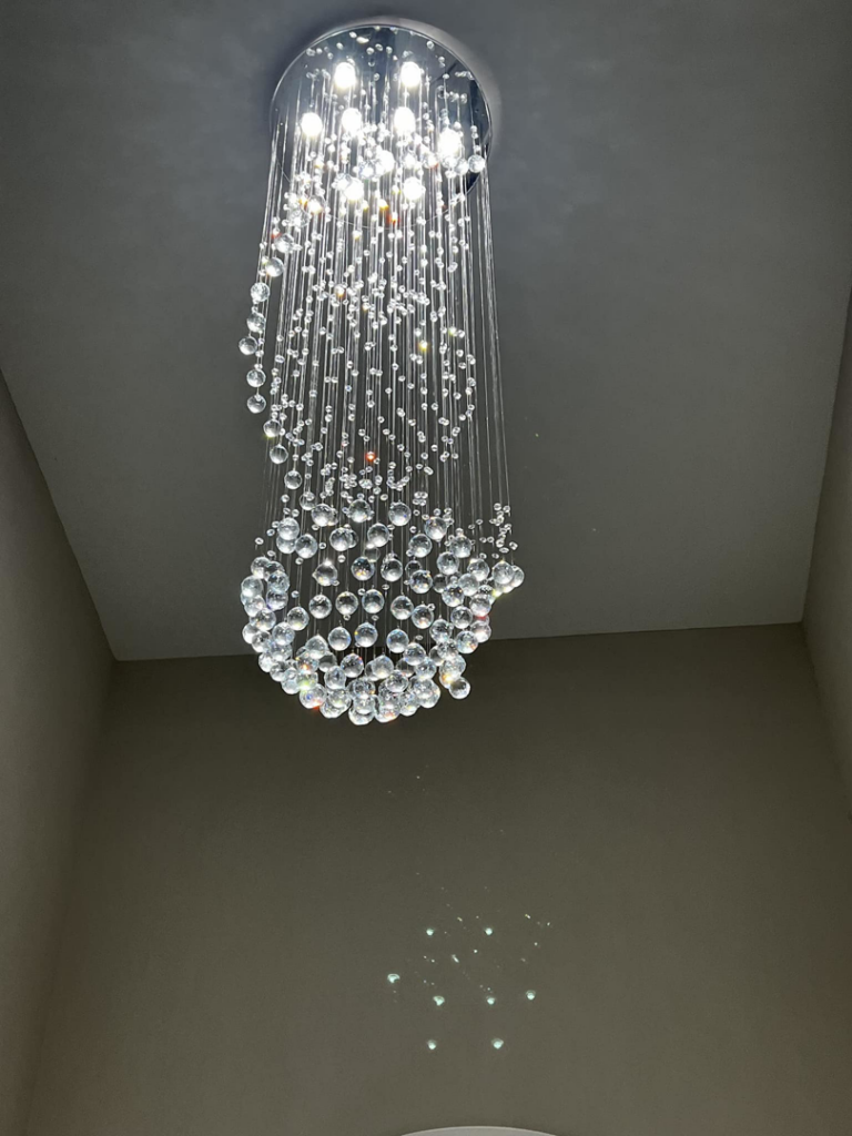 A beautiful decorative crystal chandelier installed by Harris Boys Electrical Services in Flint, MI