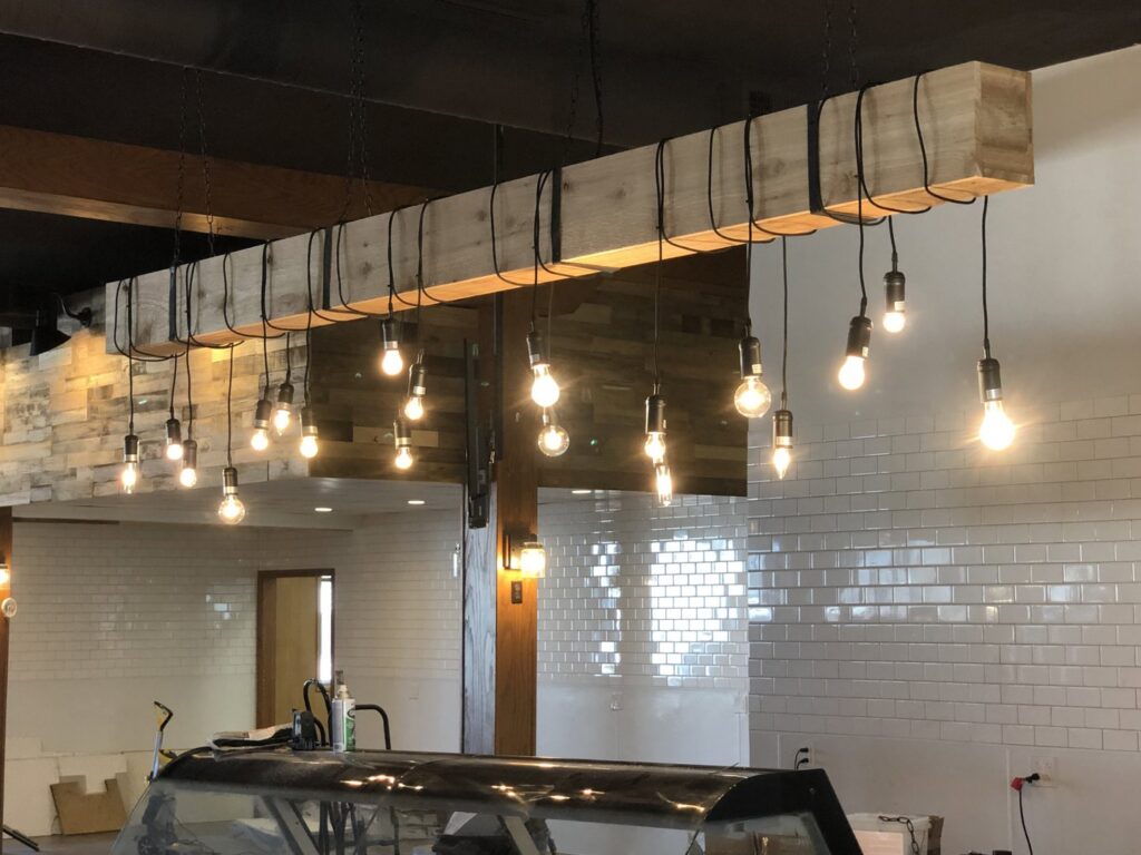 Unique decorative light fixture with exposed bulbs installed by Erbert Electric in Overland Park, KS