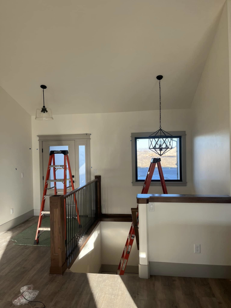 Installation of decorative light fixtures in a home by One Electric LLC in Idaho Falls, ID