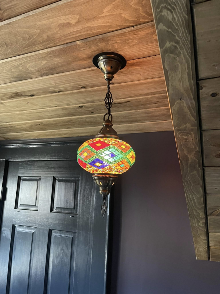 A colorful, decorative hanging light fixture installed by Richard A. Gibbons in Dracut, MA.