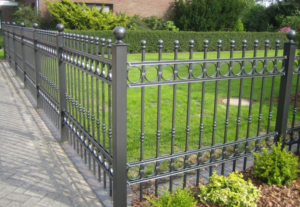 A newly installed decorative black metal fence along a residential property by Colorado Fence and Gate Systems in Colorado Springs, CO.