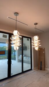 Two decorative pendant lights newly installed in a modern home by A Solid Connection Electrical Services in Brandon, FL.