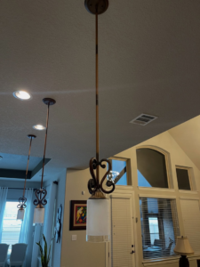 Decorative pendant lights and recessed lighting installed by Powered By Voltron in San Antonio, TX.