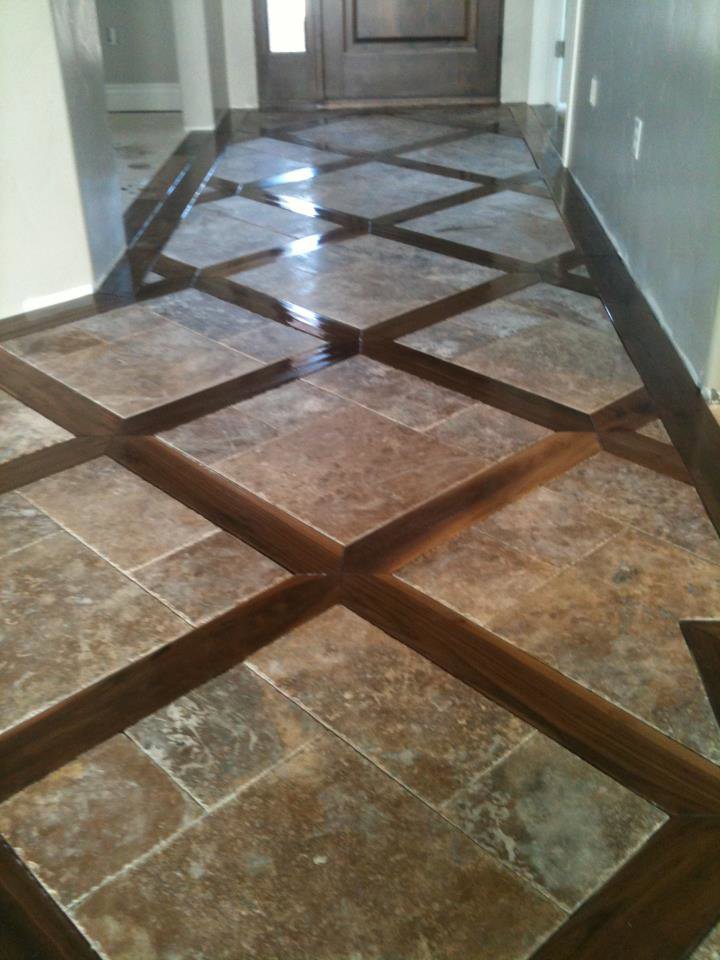 Decorative tile and wood inlay flooring in a hallway by Carpets By Cal Inc in Vernal, UT